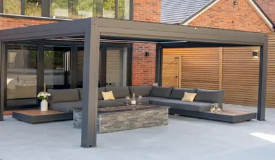 An outdoor sofa under a pergola