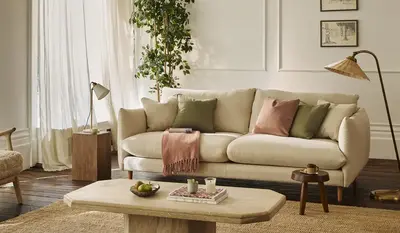 A cream sofa in a bright living room