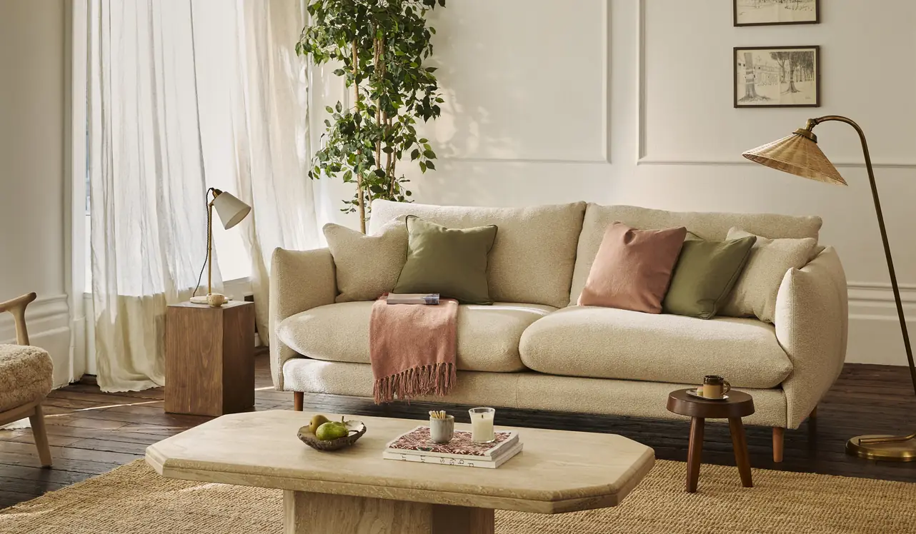 A cream Darlings of Chelsea sofa in a sunlit living room