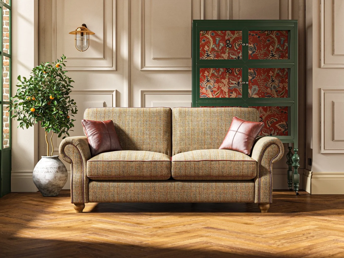 A Wood Bros sofa styled in a period room with panelled walls