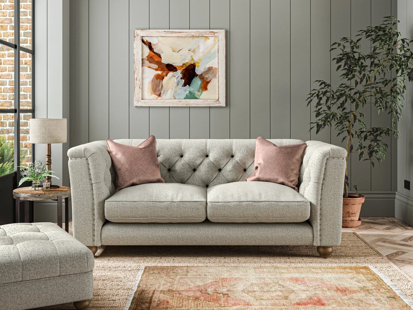 A buttoned Wood Bros sofa in a panelled living room